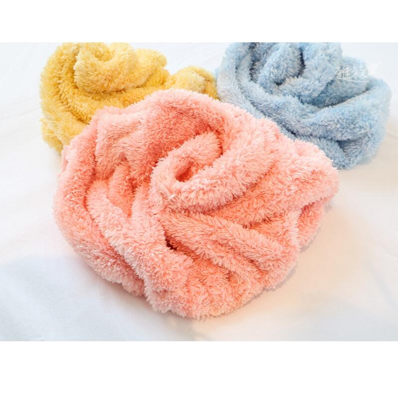 Colors of microfiber hair drying turban: orange, yellow, and blue